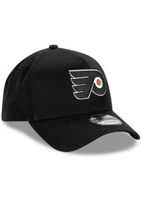 Black baseball cap made of fabric. Features a white and orange Philadelphia Flyers logo on the front, curved bill, and stitched accents.