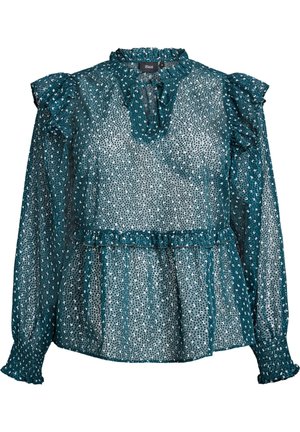 Tiefgrüne Bluse mit Rüschenschultern und -kragen. Das transparente Material hat weiße und dunkelgrüne Punkten, eine Peplum-Taille und lange Ärmel mit Rüschensäumen.