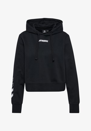 Czarna krótka bluza z kapturem z przodu z trokami i białym logo "HUMMEL". Posiada biały wzór w chevron na lewej rękawie, wykonana z bawełnianego materiału.