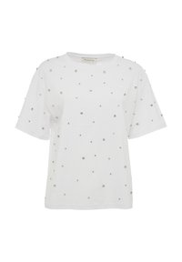 White cotton T-shirt with short sleeves, featuring scattered silver studs and a small white logo on the front. Relaxed fit and smooth texture.