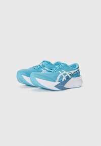 Light blue athletic shoes with a mesh upper, white accents, a curved white midsole, and blue patterned details on the heel.