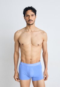 Calvin Klein blauwe katoenen boxershorts met een elastische tailleband en witte logotekst. Een gladde textuur en een aansluitend ontwerp.