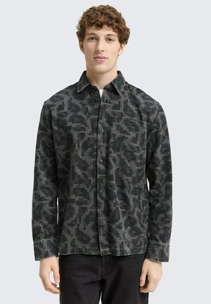 Dark gray button-up shirt with a geometric camouflage pattern, featuring a chest pocket and a classic collar, made of soft fabric.