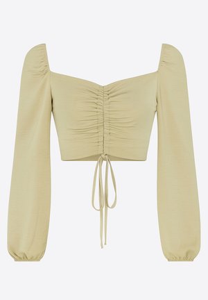 Lysegrøn crop top med firkantet halsudskæring, lange pufærmer og snøre ved taljen. Fremstillet af blødt, elastisk stof.