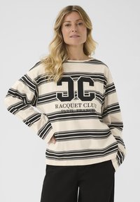 Gestreiftes sweatshirt in Beige und Schwarz mit langen Ärmeln, das das "JC"-Logo und den Text "RACQUET CLUB PARIS FRANCE" zeigt. Es hat eine lockere Passform und eine weiche Textur.