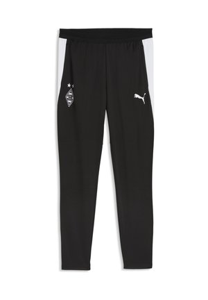 Zwarte sportbroek met witte zijstrepen, met een sportteamlogo op de linker dij en een Puma-logo op de rechter dij.