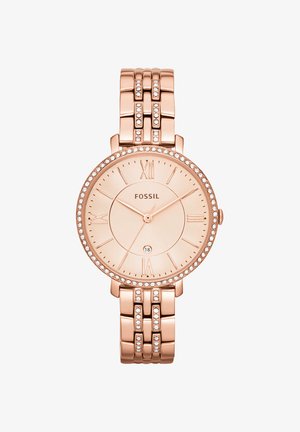 Montre-bracelet Fossil en or rose avec lunette et bracelet sertis de cristaux, index chiffres romains et affichage de la date à 6 heures.
