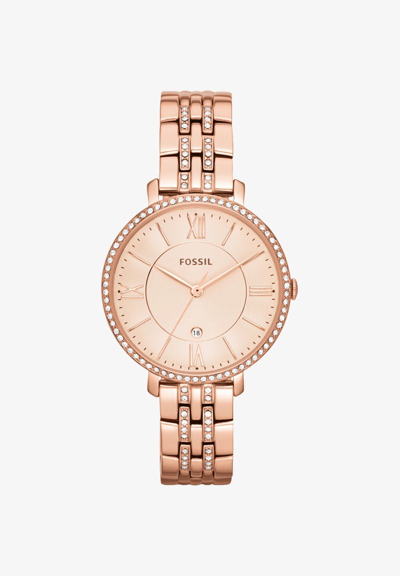 Montre-bracelet Fossil en or rose avec lunette et bracelet sertis de cristaux, index chiffres romains et affichage de la date à 6 heures.