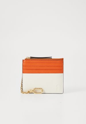 Wallet made of textured orange and white leather, featuring a zip pocket, card slots, and a gold chain with a clasp. Simple logo detail.