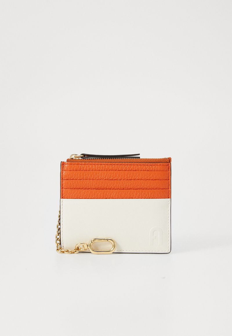 Wallet made of textured orange and white leather, featuring a zip pocket, card slots, and a gold chain with a clasp. Simple logo detail.