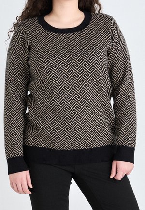 Black and beige patterned sweater with a crew neckline, textured knit design, and ribbed cuffs. Paired with black pants.