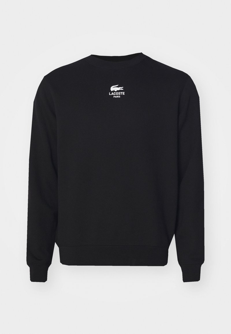 Sweatshirt noir à manches longues avec col rond, logo Lacoste blanc et texte "Lacoste Paris" centré près du col.