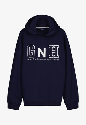 Mørkeblå hættetrøje lavet af bomuld med en kængurulomme. Har et stort hvidt "GNH" logo og teksten "Gant The American Sportswear."