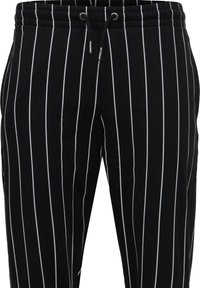 Karl Kani SIGNATURE PINSTRIPE PANTS UNISEX - Treniņtērpa apakšdaļas - black