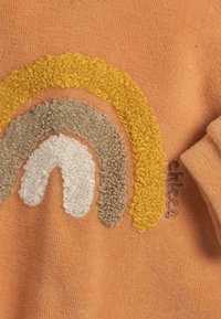 Chicco Tutina - orange