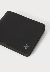 Black wallet made of textured fabric, featuring visible stitching and a small logo in the bottom right corner. Square shape with rounded edges.