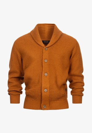 Ruosteenvärinen neuletakki, joka on tehty teksturoidusta neuleesta. Takissa on shaali kaulus, viisi nappia, sekä resorit hihansuissa ja helmassa.