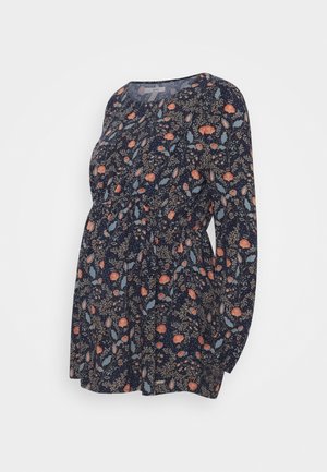 Navy blue maternity blouse with long sleeves, round neckline, and floral print in peach, blue, and beige tones.