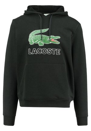 Sweat à capuche noir avec poche kangourou devant, motif crocodile vert et texte "LACOSTE" sur la poitrine.