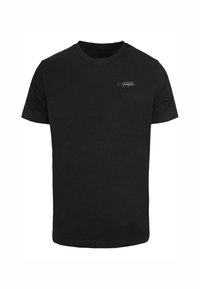 Sort bomulds T-shirt med klassisk rund hals, korte ærmer og et lille hvidt logo på venstre brystområde. Blød tekstur.