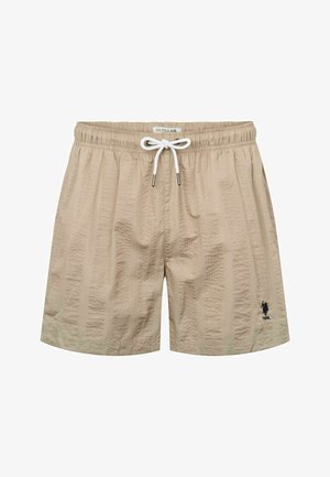 Kreminės spalvos maudymosi šortai su tekstūruota raštu, elastinga juosta ir balta virvele. Mažas juodas logotipas yra apatiniame kairiajame kampe.