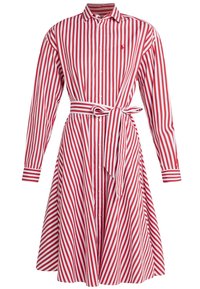 Czerwona i biała sukienka koszulowa w paski z kołnierzykiem, długimi rękawami, paskiem w talii i rozkloszowaną spódnicą. Wykonana z lekkiego materiału.