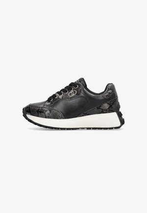 Black sneaker with leather and textured fabric upper, featuring a white midsole, black traction outsole, and metallic logo detail.