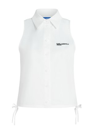 Λευκό αμάνικο τοπ με γιακά και κουμπιά μπροστά, με δεσίματα στα πλάγια και μικρό λογότυπο «KARL LAGERFELD JEANS» στο αριστερό στήθος.
