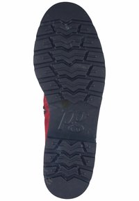 Semelle en caoutchouc avec un motif de semelle robuste pour une bonne traction. Couleur noire avec le logo du fabricant en relief. Bords légèrement arrondis.