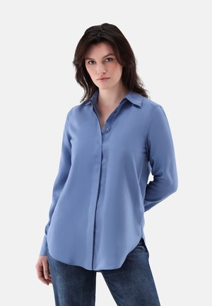 Blue long-sleeve button-up shirt made of smooth fabric, featuring a pointed collar, front buttons, and rounded hemline.