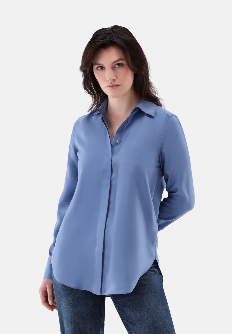 Blue long-sleeve button-up shirt made of smooth fabric, featuring a pointed collar, front buttons, and rounded hemline.