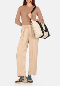 Rains MINI W3 - Bolso de mano - dune