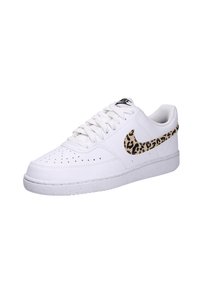 White leather sneaker featuring a leopard print Nike swoosh, round toe, perforations on the toe box, and textured rubber outsole.