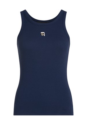 Mornarsko modra brezrokavnik z rebrasto tkanino, okrogel izrez in majhen vezen obraz s sončnimi očali in belimi lasmi na sredini prsnega koša.