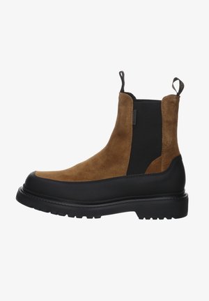 Brown suede ankle boot with black elastic side panels, rubber sole, and pull tabs for easy wear. Features a durable, rugged design.