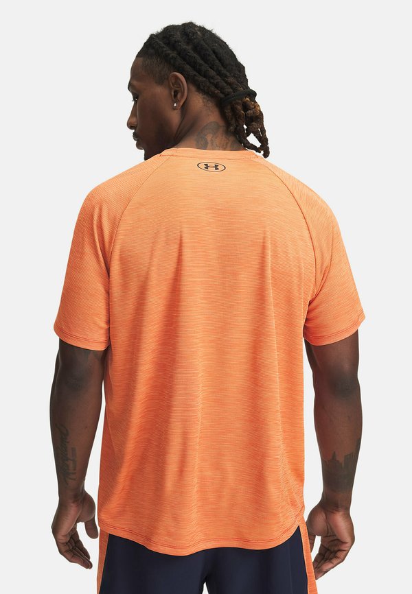 TECH TEXTURED - Sports T-shirt - solar orange2