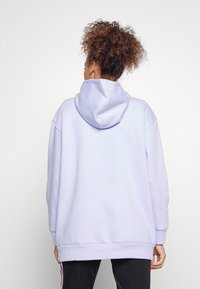 adidas Performance Jersey con capucha - purple