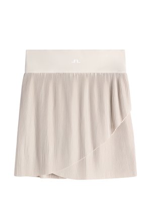 Beige liehulaskahame, jossa on kietaisuelementti ja leveä vyötärönauha, jonka keskellä edessä on pieni valkoinen logo.