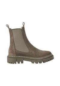 Bottines Chelsea en daim marron avec panneaux latéraux élastiques, languettes de tirage, semelle en caoutchouc épaisse et motif de crampons prononcé. Accents cousus sur la semelle.