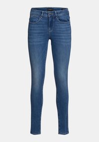Jeans de denim azul de corte slim, con una textura suave, diseño de cinco bolsillos y una cintura de altura media. Costuras decorativas a lo largo de las costuras.