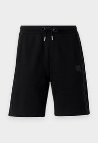 Black sweat shorts with drawstring waist, side pockets, textured side panels, and a small logo detail. Made from soft fabric.
