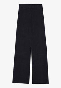 Pantalones de punto acanalado negros de pierna ancha con cinturilla elástica, acostados sobre un fondo blanco.
