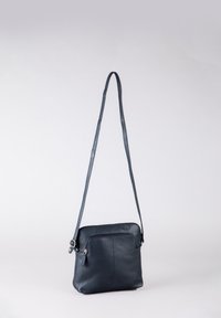 Dark blue leather crossbody bag with a smooth texture, rectangular shape, adjustable strap, and a front zip pocket for storage.
