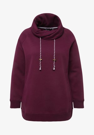 Sudadera burdeos con cuello tipo cowl, con cordones blancos y detalles metálicos dorados. Tela suave, corte relajado y puños acanalados.