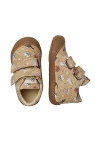 Tanfarbene Stoffschuhe mit Dinosaurier-Muster, ausgestattet mit zwei verstellbaren Klettverschlüssen und einer Gummisohle für guten Halt. Mit abgerundetem Zehenbereich.