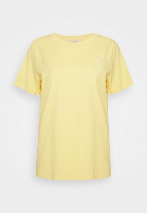 Camiseta de algodón de manga corta en color amarillo claro, lisa, con cuello redondo y corte relajado, mostrada sobre un fondo blanco.