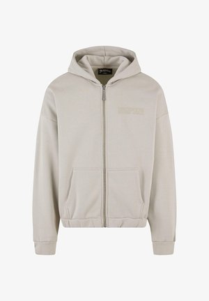 Sweat à capuche zippé beige clair avec un cordon de serrage, poches avant, poignets côtelés et logo "DROPSIZE" discrètement embossé sur la poitrine.