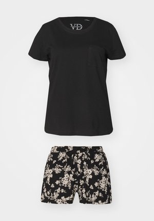 Schwarzes Baumwoll-T-Shirt mit rundem Ausschnitt und Brusttasche, kombiniert mit schwarzen Shorts mit einem weißen Blumenmuster und einer Kordelzug taille.