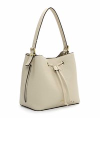 Cream-colored bucket bag made of textured leather, featuring a drawstring closure, gold hardware accents, and a contrasting black trim.
