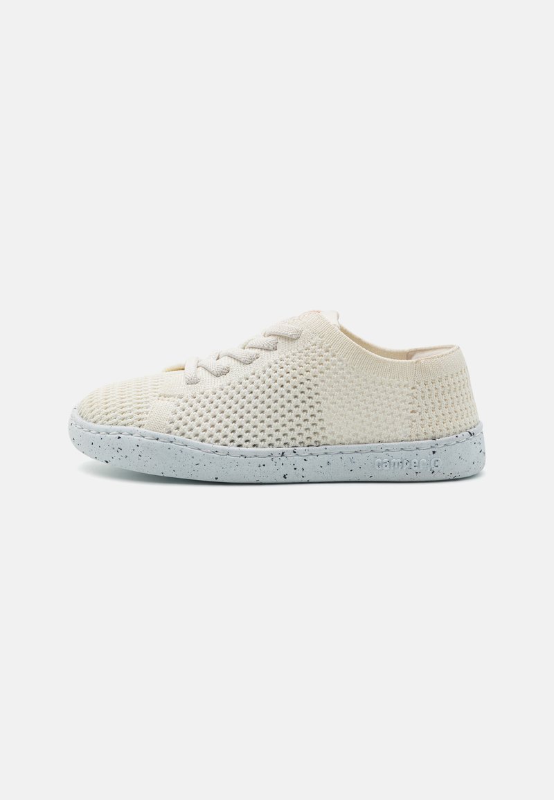 Beige knitted sneakers with breathable mesh upper, white speckled rubber sole, and lace-up design. Round toe and low-profile silhouette.